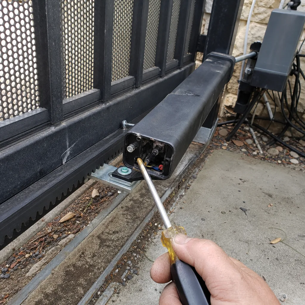Technician performing professional electric sliding gate repair and maintenance
